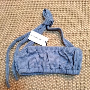 We wore what BLUE heather halter top with tie at neckline.